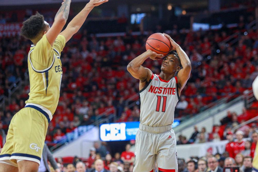 Junior guard Markell Johnson shoots a three. After starting off cold, Johnson made four threes on the way to a team-high 17 points. The Wolfpack was not able to make the most of it and fell 63-61 to Georgia Tech on Wednesday, March 6 in PNC Arena.