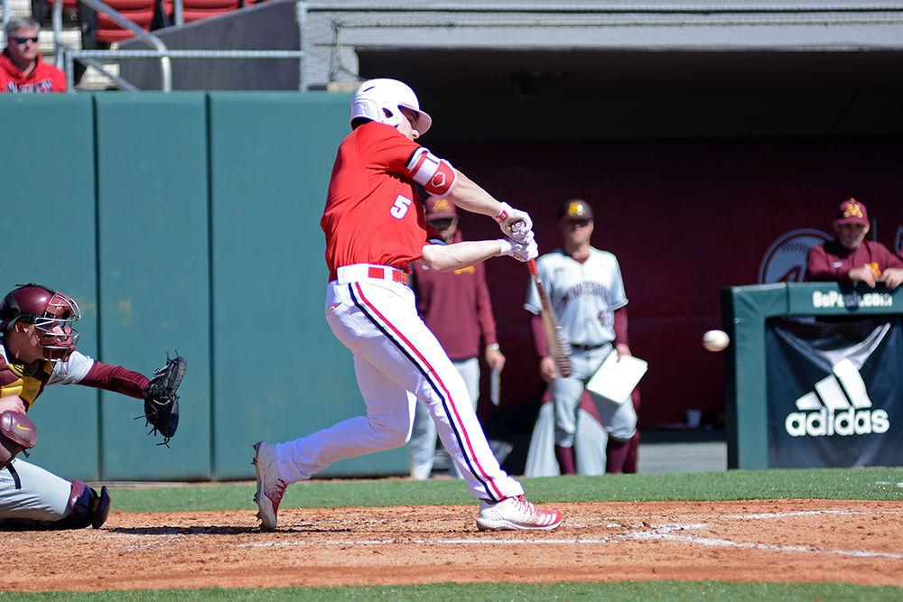 Sophomore catcher Patrick Bailey bats at the ball during the first game of the doubleheader against Minnesota on Saturday, March 2, in Doak Field. The Wolfpack beat the Gophers 3-2, with Bailey going 0-2.