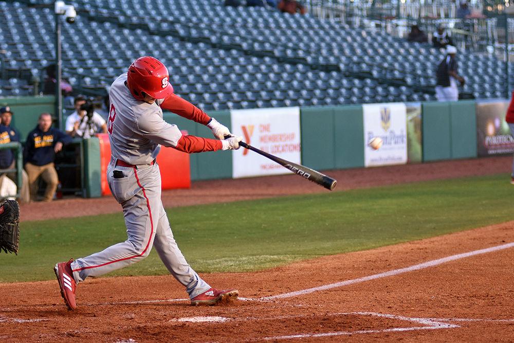 Junior infielder Will Wilson bats the ball during the game against NC A&amp;T on Wednesday, March 27, at First National Bank Field. The Wolfpack beat the Aggies 12-3, with Wilson went 4-2 with one home run, one double, three runs scored, and four runs batted in, and one strikeout.