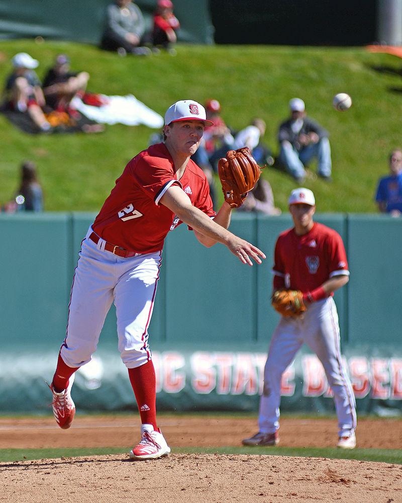 Junior pitcher Jason Parker attempts a pickoff during the first game of the doubleheader against Minnesota on Saturday, March 2, 2019 at Doak Field. The Wolfpack beat the Gophers 3-2, with Parker pitching 5.1 innings, giving up four hits, one earned run, and striking out four.