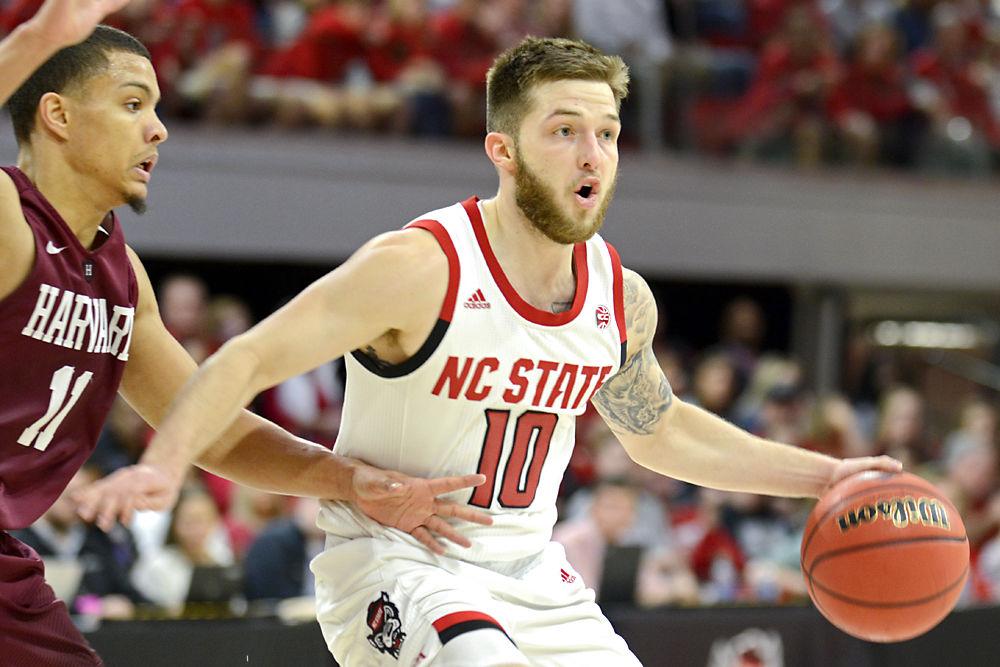 Sophomore guard Braxton Beverly searches for an open teammate against Harvard on Sunday, March 24, 2019 in Reynolds Coliseum during the second round of the NIT. Beverly shot 2-9 from the field and contributed 10 points to the 78-77 win over the Crimson.&#160;