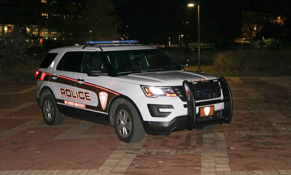 An NC State police car sits on the brickyard on Tuesday, Nov. 20, 2018. The campus police department provides services including the Wolfguard ID and Ride-Along programs, safety escort and lost and found property.