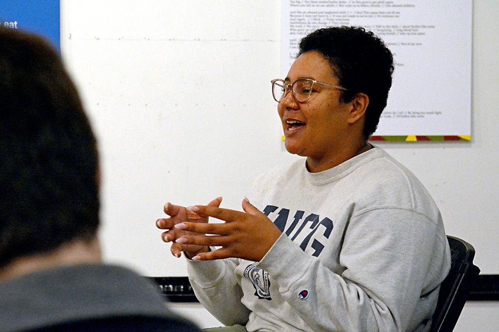 Erin Elliot, a second-year masters degree student in educational psychology, contributes to the discussion at Mixtape Series: The Political Strategies of Academia that Dismember Black Bodies on Thursday, March 21. The event, held in the African American Cultural Center, explored issues of inadequate inclusion of marginalized campus groups, particularly African-Americans. Elliot spoke about the societal, unrealistic expectation to be unique while also fitting into normative behaviors and appearances.