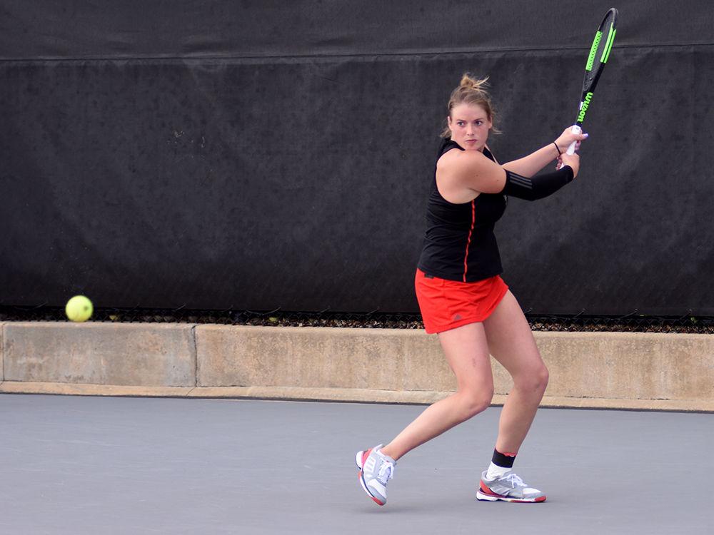 No. 31 junior Anna Rogers returns a ball from Miami's No. 2 Estela Perez-Somarriba during the match on Friday, March 22 in the J.W. Isenhour Tennis Center. The No. 12 Wolfpack beat the No. 25 Hurricanes 6-1, with Rogers winning her singles match 2-1.