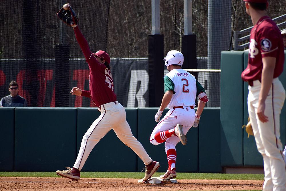 Sophomore outfielder Jonny Butler jumps towards first base during the game against Florida State on Sunday, March 17, in Doak Field. The Wolfpack lost 5-7 to the Seminoles, with Butler having 1 strikeout.