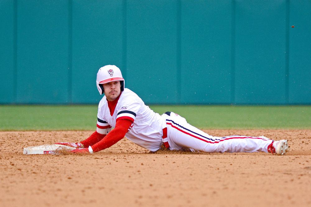 *Editor's note: the original photo has been replaced.
Junior outfielder Lawson McArthur slides into second base against Pittsburgh on Friday, March 8, 2019 at Doak Field. McArthur went 2-2 with two doubles and one run scored in the Wolfpack's 4-3 win.