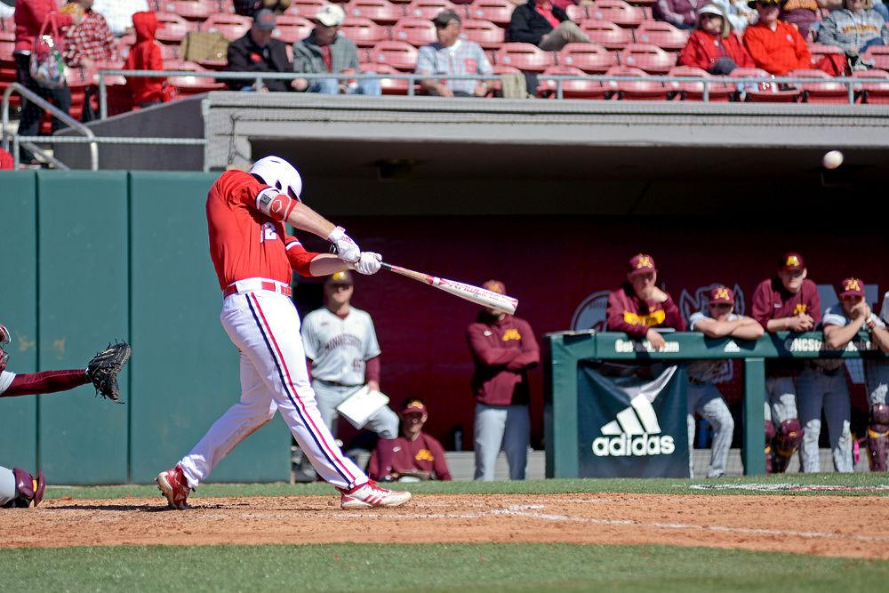 Junior center Brad Debo swings at the first game of the double header against Minnesota on Saturday, March 2, 2019 at Doak Field. The Wolfpack beat the Gophers 3-2, with Debo going 2-3 with one run scored.