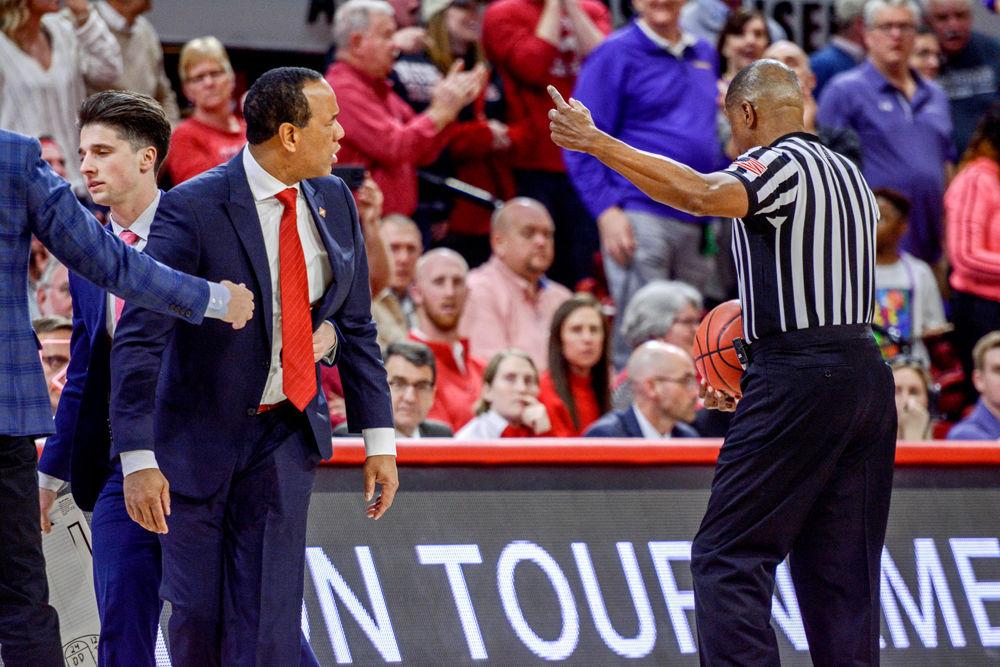 Head coach Kevin Keatts gets held back after a controversial call during the game against Lipscomb in Reynolds Coliseum on Wednesday, March 27, 2019. The Wolfpack lost 94-93 to Lipscomb, causing them to get knocked out of the NIT.