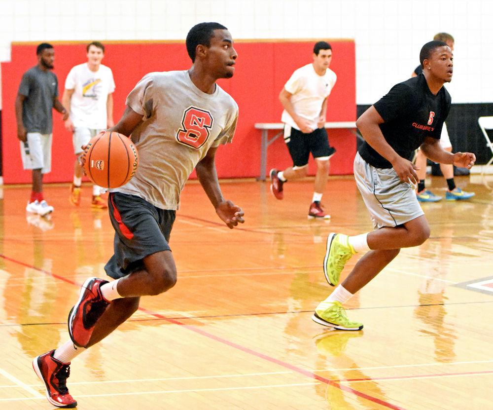 Quante Lee, a third-year in chemical engineering, drives up the court at a club basketball scrimmage which was held in Carmichael Gym on Wednesday, Sept. 14, 2015.