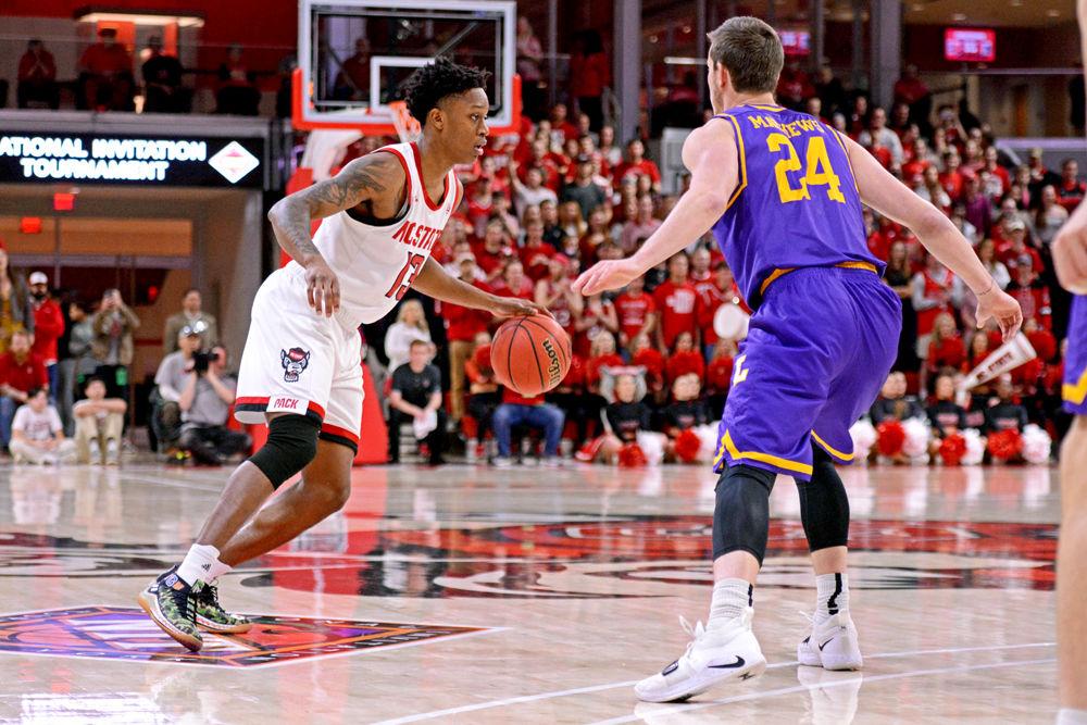 Redshirt junior guard C.J. Bryce handles the ball in Reynolds Coliseum on Wednesday, March 27, 2019. Bryce scored 10 points and had 5 rebounds. The Wolfpack lost 94-93 to Lipscomb.