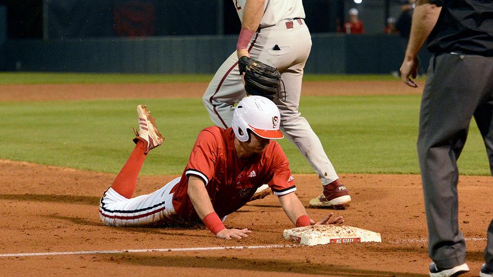 Sophomore infielder David Vazquez slides into third base during the game against Florida Sate on Friday, March 15, 2019at Doak Field. Vazquez went 2-5 with one double, one run scored and one strikeout in the Wolfpack's 16-0 win.
