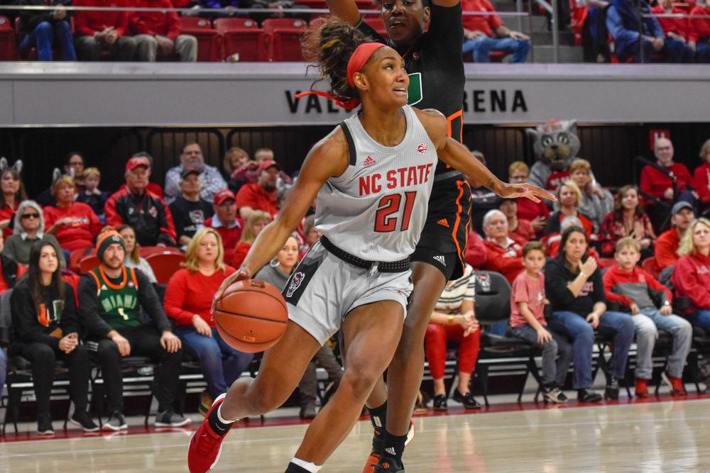 Senior forward DD Rogers avoids Miami's defense and scores 21 points. The Wolfpack won the game 70-68 in Reynolds Coliseum on Sunday, March 3, 2019.