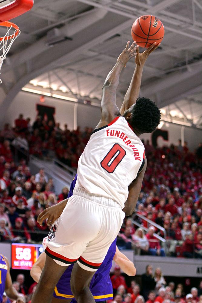 Redshirt sophomore forward DJ Funderburk reaches for a rebound in Reynolds Coliseum on Wednesday, March 27, 2019. Funderburk had 6 points. The Wolfpack lost 94-93 to Lipscomb, causing them to get knocked out of the NIT.