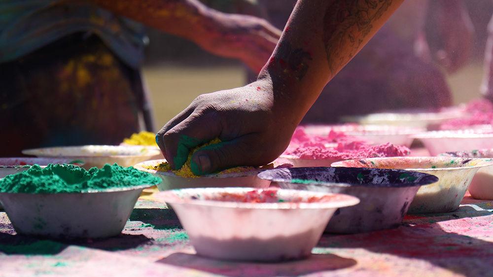 Bowls of Holi powder are available for participants to grab on March 24 at Lee Field.