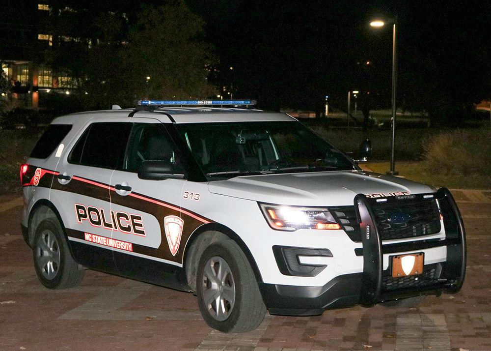 An NC State police car is parked in the Brickyard on Nov. 20, 2018. The campus police department provides services including the Wolf Guard ID and Ride-Along Program, safety escort services and lost and found property.