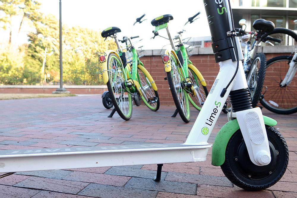 Lime-S electric scooters are seen outside Talley Student Union on Nov. 20. While both Lime and Bird will be removed from the city of Raleigh, Lime bikes and scooters will still be available on campus.