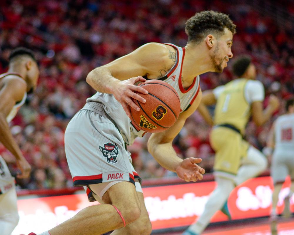 Redshirt sophomore guard Devon Daniels drives down the court during the game against Georgia Tech on Wednesday, March 6 in PNC Arena. Daniels scored 13 points. The Wolfpack lost to the Yellow Jackets 63-61.