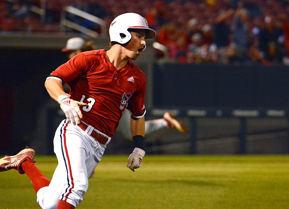 Freshman infielder Tyler McDonough sprints between bases during the game against Florida Sate on Friday, March 15 at Doak Field. McDonough went 5-4 with one double, two runs, and 3 RBI scored a in the Wolfpack's 16-0 win.