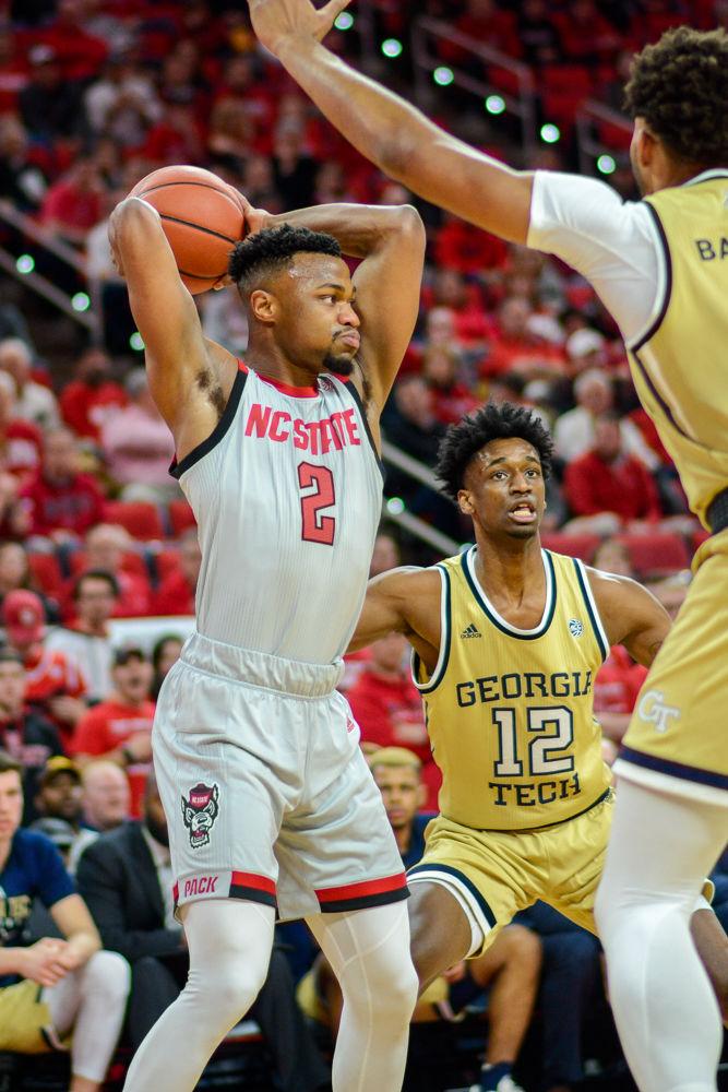 Redshirt senior guard Torin Dorn looks to pass the ball during the game against Georgia Tech on Wednesday, March 6 in PNC Arena. Dorn had 12 points and eight rebounds. The Wolfpack lost to the Yellow Jackets 63-61.