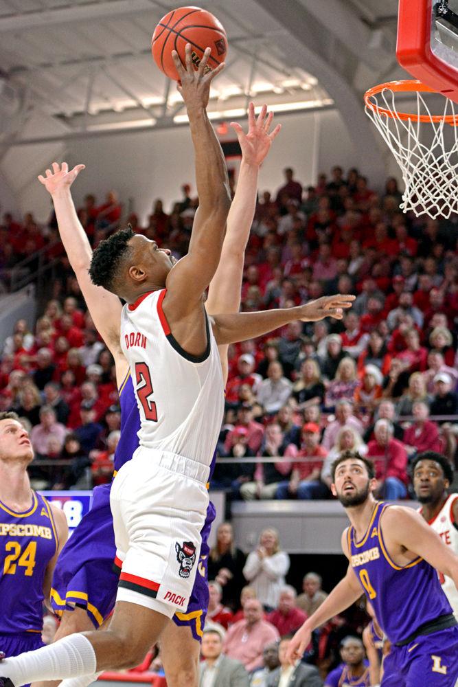 Redshirt senior guard Torin Dorn reaches for a dunk in Reynolds Coliseum on Wednesday, March 27, 2019. Dorn led the team in scoring with 34 points, shooting 15-22 from the field. The Wolfpack lost 94-93 to Lipscomb.
