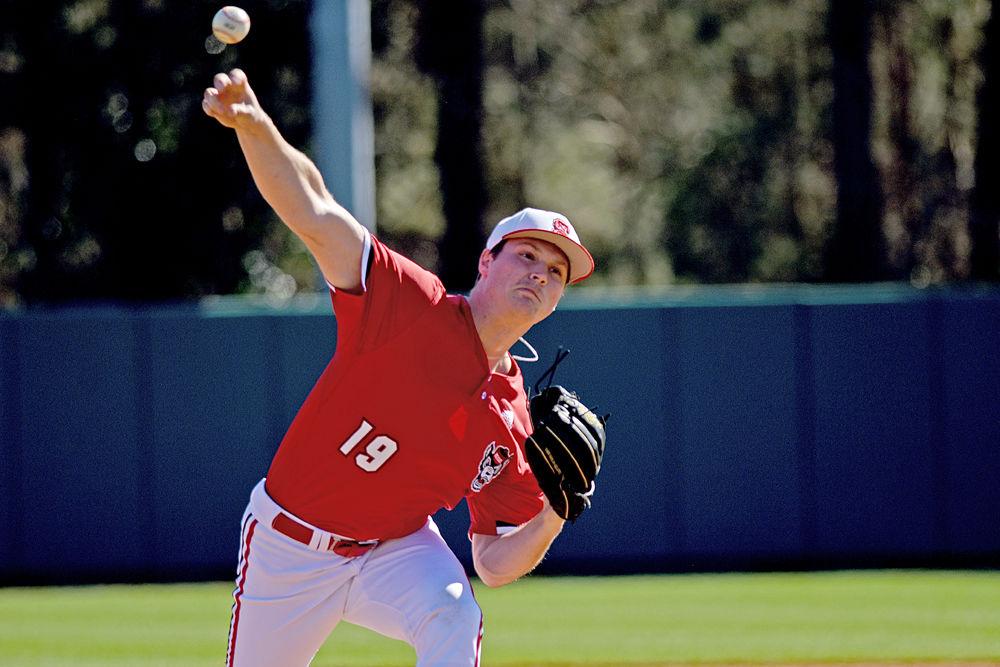 Redshirt sophomore pitcher Dalton Feeney launches the ball during the game against Minnesota on Saturday, March, 2019 at Doak Field. Feeney pitched 2.1 innings, striking out two and giving up two hits and zero earned runs. The Wolfpack won 3-2.