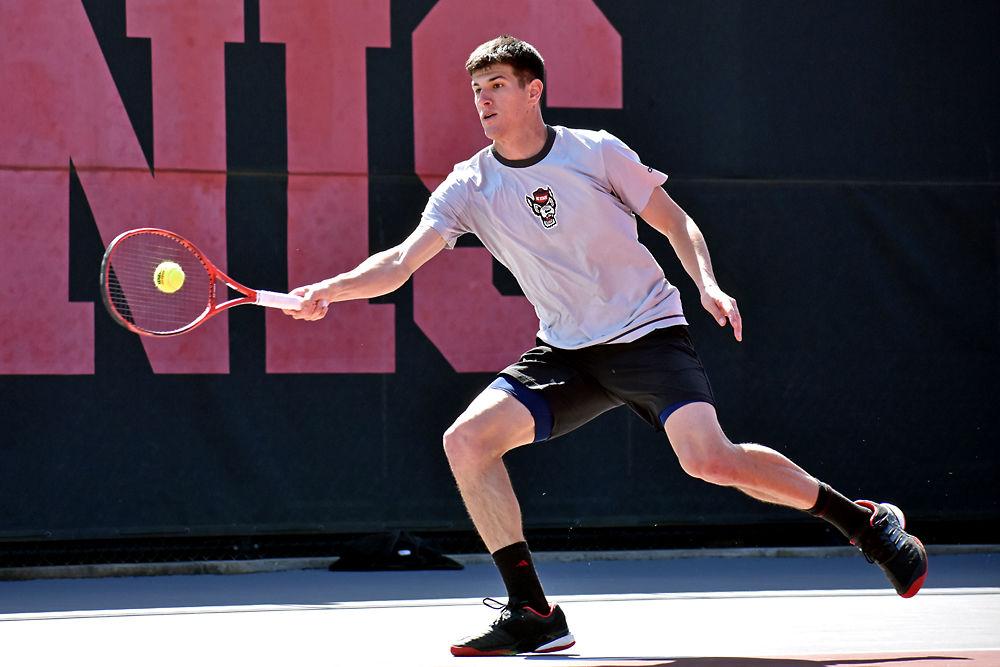 *Editor's note: the original photo has been replaced.
Senior Igor Saveljic returns a volley against Louisville senior Brandon Lancaster on Sunday, March 17, 2019 in J.W. Isenhour Tennis Center. Saveljic won the first set 6-5 and the second set 5-3. The Wolfpack defeated Louisville 4-1.