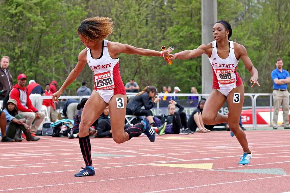 Sophomore sprinter Dejah Arnold hands the baton off to freshman sprinter Gabriele Cunningham at the first exchange in the 4x200-meter relay at the 2016 Raleigh Relays held at Derr Track on March 26, 2016. The relay team placed 11th overall in the event with a final time of 1:39.05.
