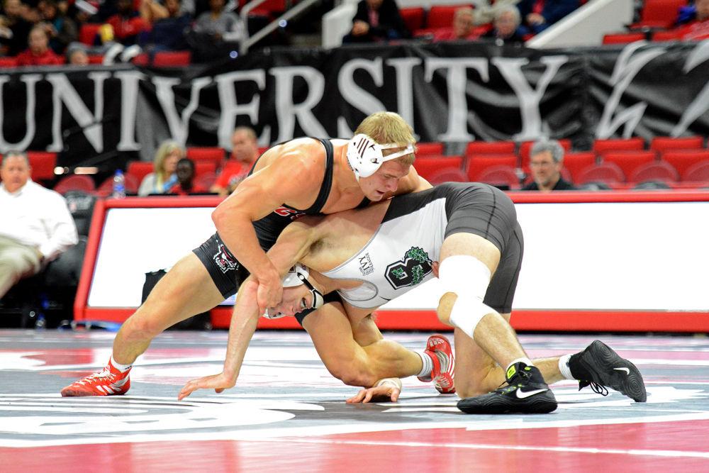 Hayden Hidlay, a redshirt sophomore in the 157-pound weight class, wrestles Brown senior Christian LaBrie on Saturday, Jan. 12, 2019 at PNC Arena. The Wolfpack won 29-10.