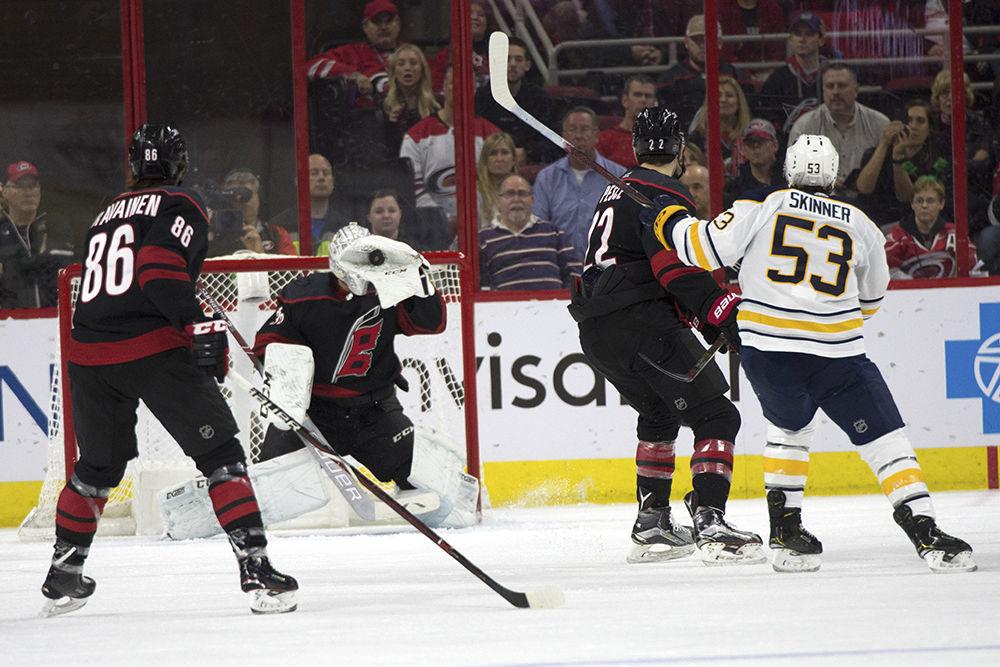 Carolina Hurricanes goalie Curtis McElhinney catches the puck shot by Buffalo Sabres forward, and ex-Hurricane, Jeff Skinner in PNC Arena, Saturday, March 16. The Canes won against the Sabres, 4-2.&#160;
