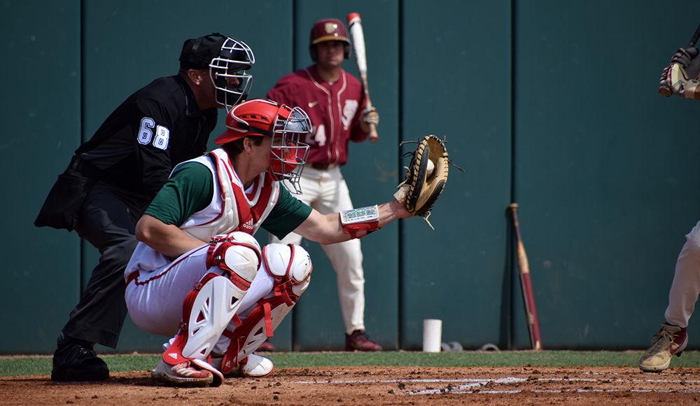 Sophomore catcher Patrick Bailey catches a pitch against Florida State on Sunday, March 17, in Doak Field. The Wolfpack lost 5-7 to the Seminoles, with Bailey having 1 hit, 1 walk and 1 strikeout.