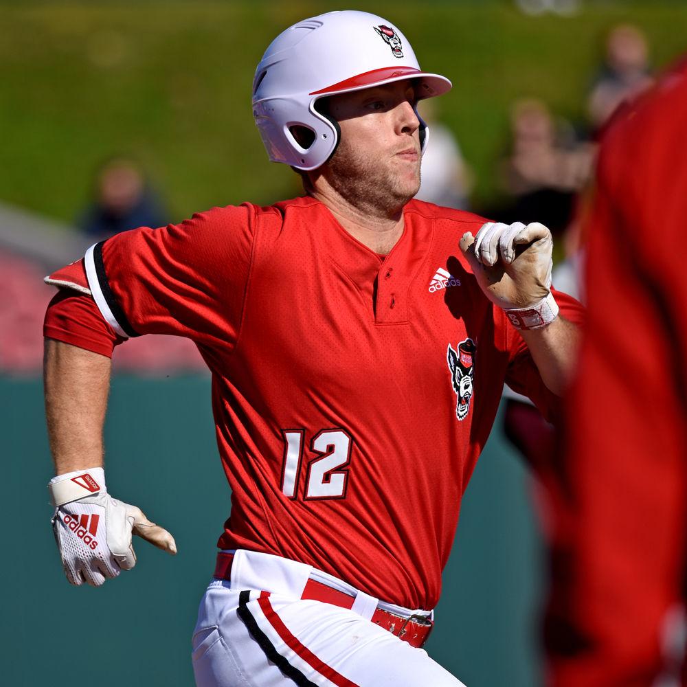 Junior catcher Brad Debo sprints to first base against Minnesota on Saturday, March 2, 2019 at Doak Field. Butler went 2-3 with one run batted in and one run scored as the Wolfpack won 3-2.