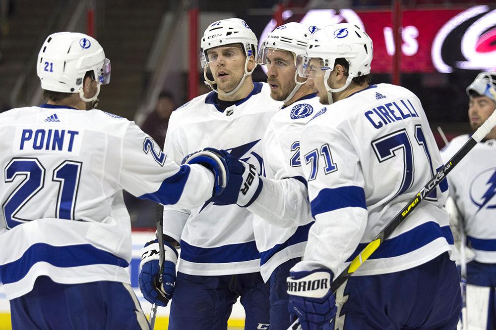 Tampa Bay Lightning defenseman Ryan McDonagh celebrates his game winning goal on an empty Carolina Hurricanes net with teammates late in the third period, Thursday, March 21 in PNC Arena. The Canes lost to the Lightning, 3-6 in regulation.