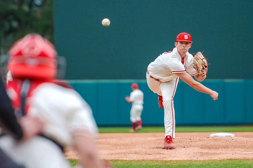 Sophomore pitcher Reid Johnston warms up before facing Minnesota on Sunday, March 3, 2019 at Doak Field. Johnston pitched four innings, striking out two while giving up two earned runs on four hits and three walks. The Wolfpack won 5-4 via junior catcher Brad Debo&#8217;s walk-off base hit.