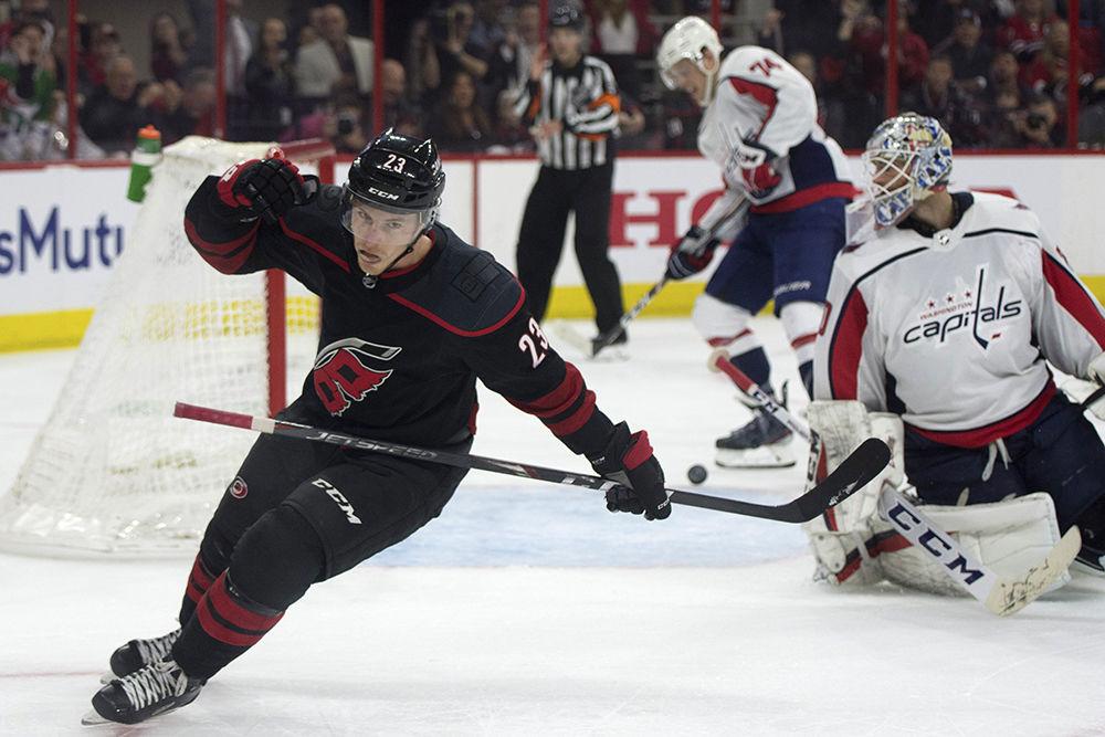 Left wing Brock McGinn bails out after scoring the game winning goal against the defending Stanley Cup champions in PNC Arena, Monday, April 15. The Canes won, 5-0 in regulation time, shutting out the Washington Capitals.&#160;
