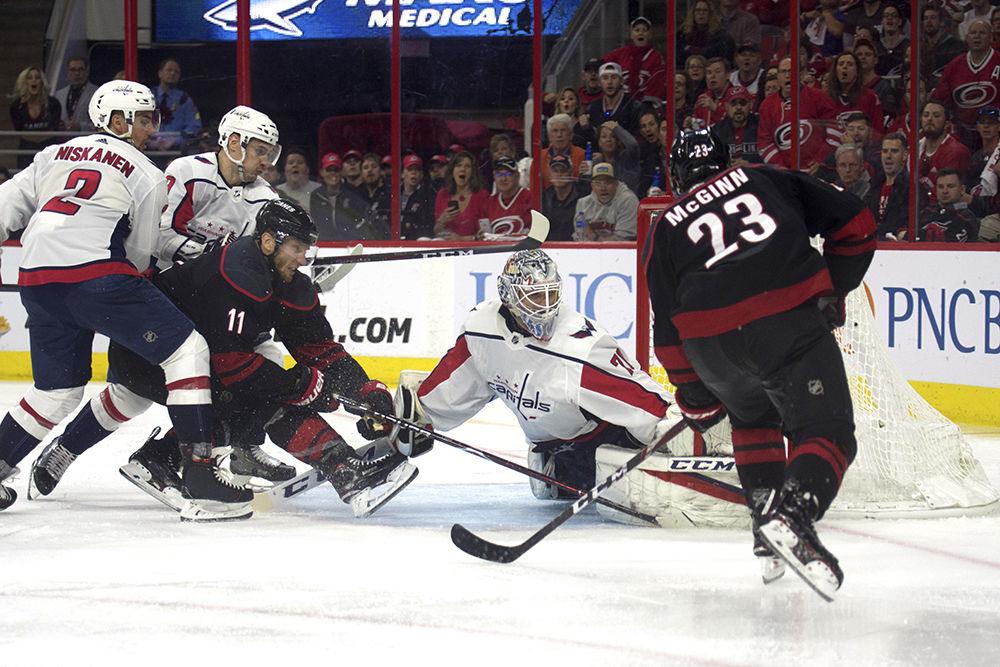 Center Jordan Staal pushes the puck past Washington Capitals goaltender Braden Holtby to give Carolina the upper-hand against the reigning Stanley Cup champions in PNC Arena, Monday, April 22. The Canes tied up the series with a 5-2 victory during game six, and are headed back to Washington D.C. to finish the series on Wednesday, April 24.&#160;