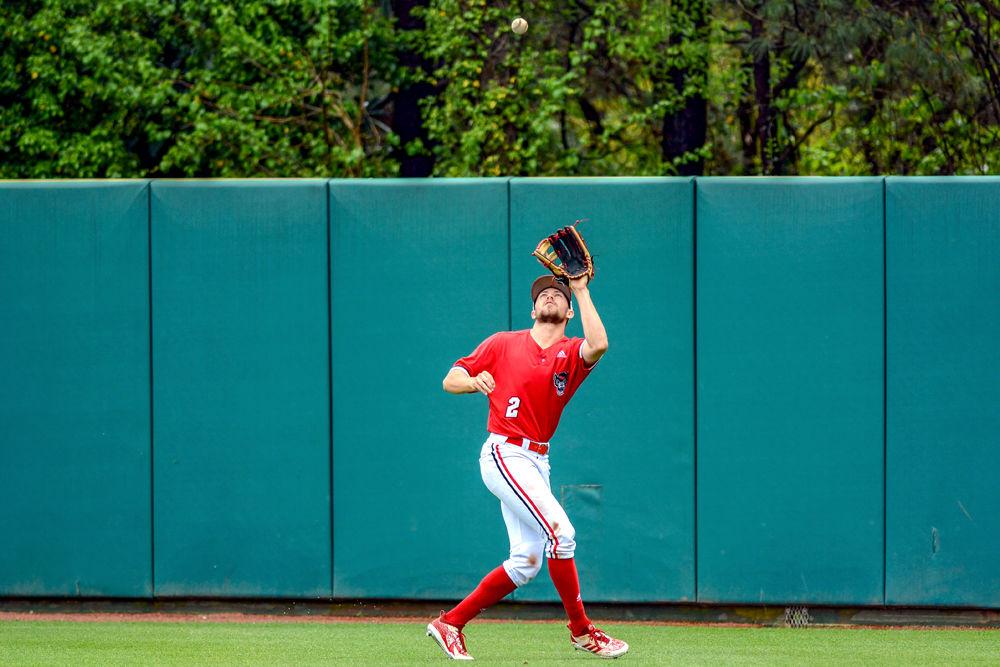 Sophomore outfielder Jonny Butler catches a fly ball against Louisville on Saturday, April 13, 2019 at Doak Field. Butler went 2-5 in the Wolfpack&#8217;s 14-10 loss to the Cardinals.