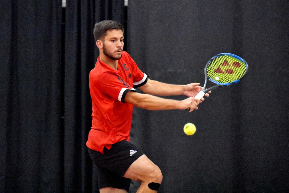 Junior Alexis Galarneau reaches for the ball during his singles match in J.W. Isenhour Tennis Center on Wednesday, March 20, 2019. He lost the match 7-5, 6-1 as the Wolfpack lost 4-2 overall to Wake Forest.