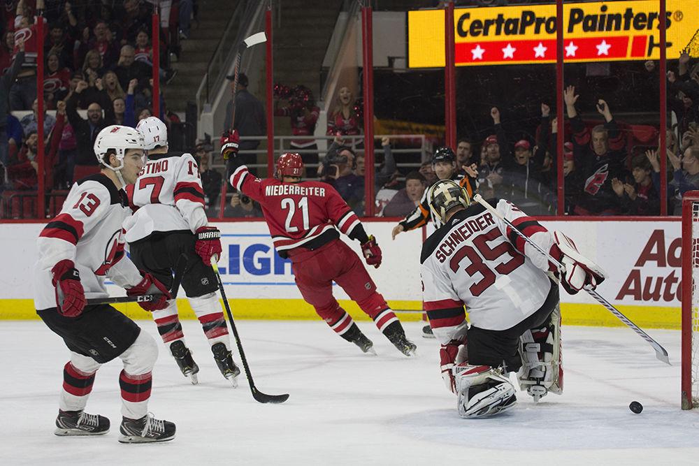 Right wing Nino Niederreiter bails to celebrate his game winning goal, helping the Canes beat the New Jersey Devils, 3-1 in PNC Arena, Thursday, April 4.&#160;