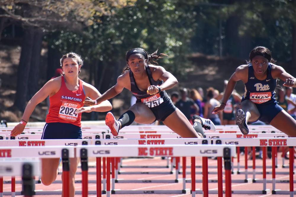 Sophomore Alexis Postell leaps over hurdles as she goes on to finish 6th overall in the women&#8217;s 100-meter hurdles at the Raleigh Relays held at the Paul Derr Track &amp; Field Facility on Friday, March 29, 2019.