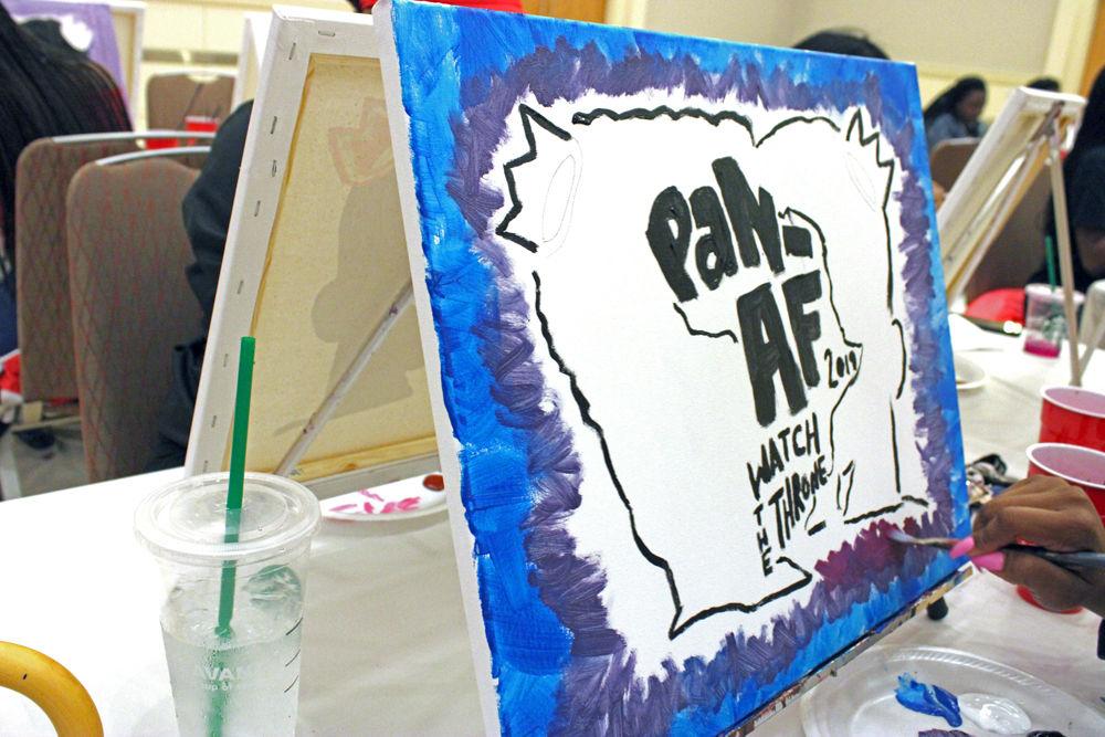 N'dea Pickett, a sophomore studying fashion and textile management, uses vibrant colors to paint her canvas at Trap n' Paint in Talley Student Union on Monday, April 8.