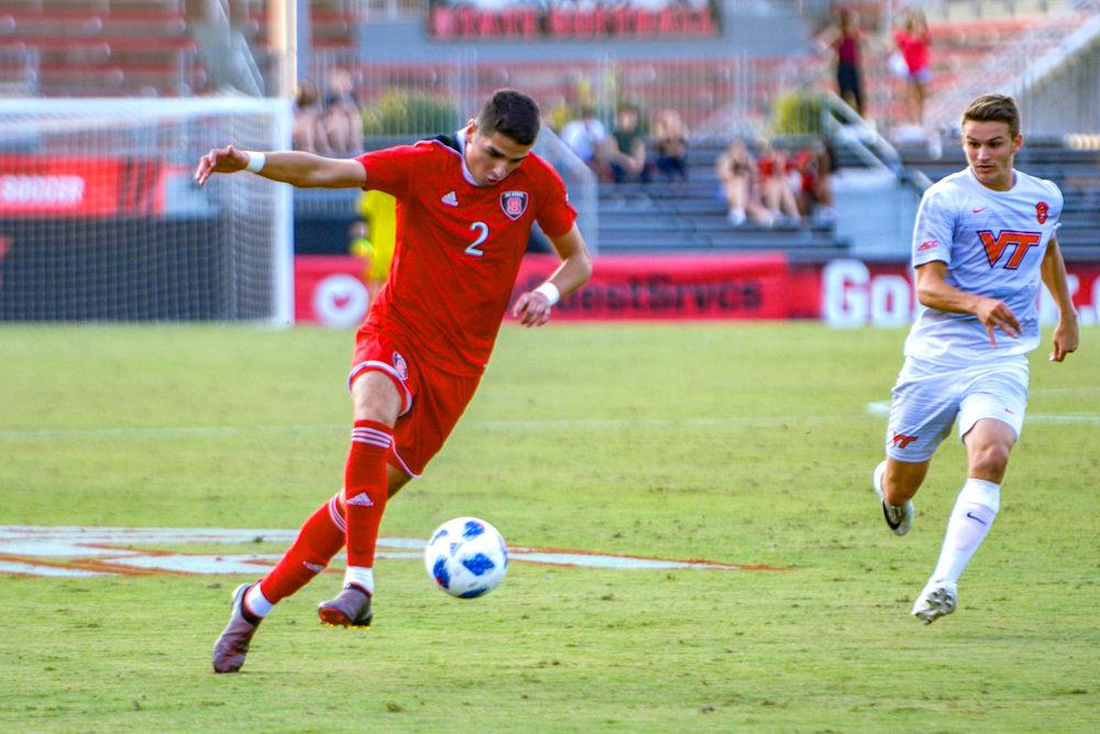 Sophomore midfielder Manny Perez dribbles the ball against Virginia Tech on Friday Sept. 21 at Dail Soccer Field. Perez had 1 shot as the Wolfpack won 1-0.