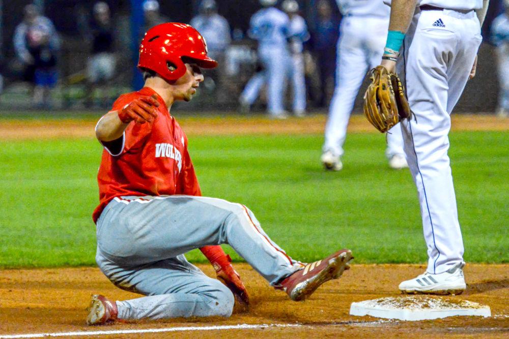 Freshman outfielder Tyler McDonough slides into third base against the UNC-Wilmington Seahawks on Tuesday, April 16, 2019 at Brooks Field in Wilmington. McDonough scored two runs for the Wolfpack. The Pack beat the Seahawks 14-7.