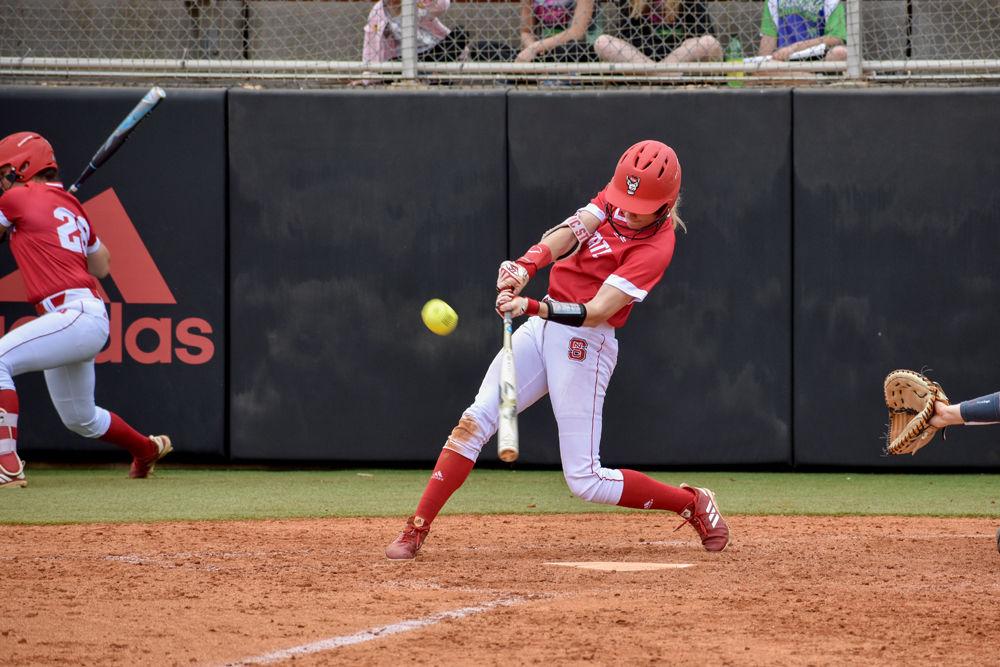 Sophomore outfielder Sam Russ hits the ball on Sunday, April 7, 2019 at Dail Softball Stadium. Russ had two hits as the Wolfpack lost to Syracuse 5-3.