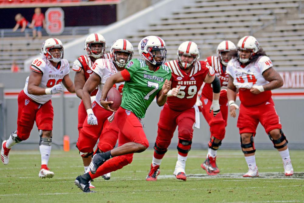 Redshirt sophomore quarterback Matthew McKay runs through the defense during the Kay Yow Spring Game on Saturday, April 6, 2019 in Carter-Finley Stadium. McKay is competing for the starting quarterback job.