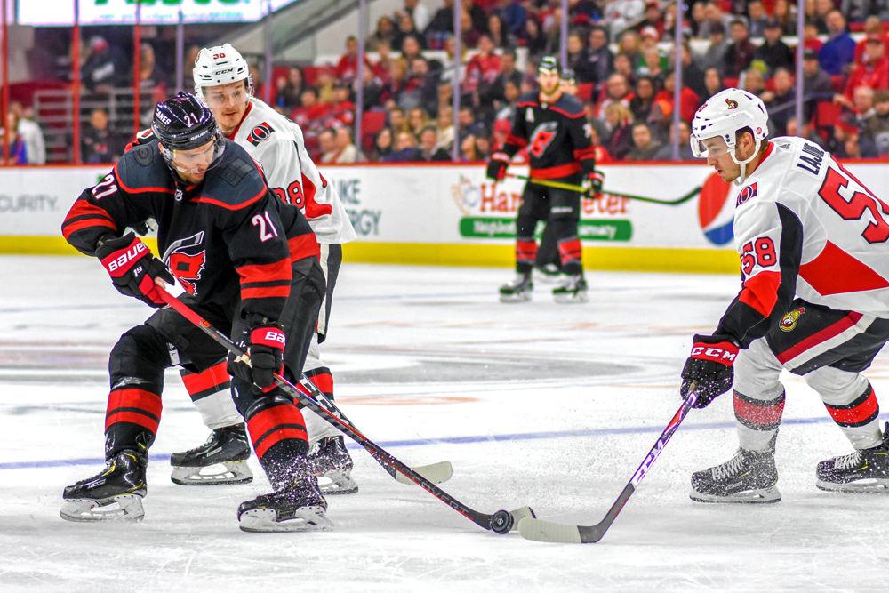 Carolina Hurricanes right winger Nino Niederreiter fights to gain control of the puck against the Ottawa Senators on Friday, Jan. 18, 2019 in PNC Arena. The game versus the Senators was Niederreiter's first game with the Carolina Hurricanes after being traded from the Minnesota Wild. The Hurricanes lost to the Senators 4-1.