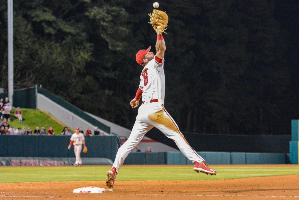 Senior infielder Evan Edwards catches a throw against Virginia on Friday, March 29, 2019 at Doak Field. The Wolfpack lost 4-3, with Edwards having 1 hit and 1 walk.