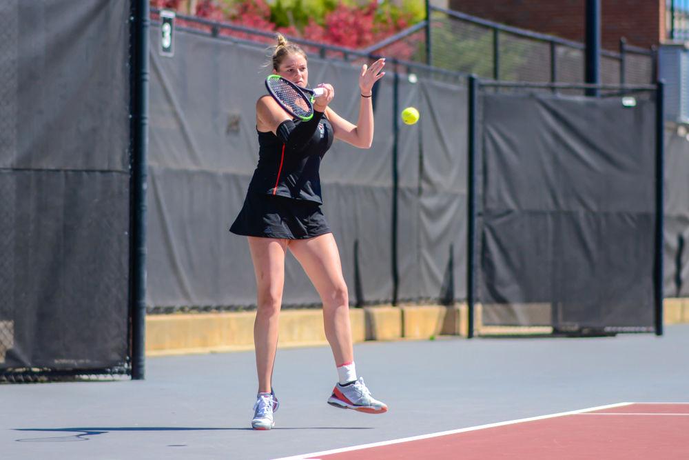 Junior Anna Rogers returns a volley against Virginia Tech during a doubles match on Sunday, March 24, 2019 at J.W. Isenhour Tennis Center. Rogers and senior Claudia Wiktorin defeated Virginia Tech senior Sarah Baron and junior Natalie Novotna 6-2 during the Wolfpack&#8217;s 5-2 overall win against the Hokies.