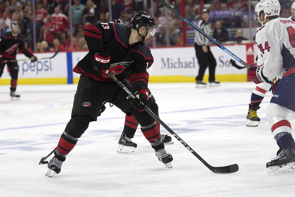 Left winger Warren Foegele maintains possession of the puck while on Washington Capitals ice in PNC Arena, Thursday, April 18. Foegele scored the first goal of the game only 0:17 seconds into the first period, helping the Canes take an early lead. The Canes tied up the series against the Caps, 2-1.&#160;