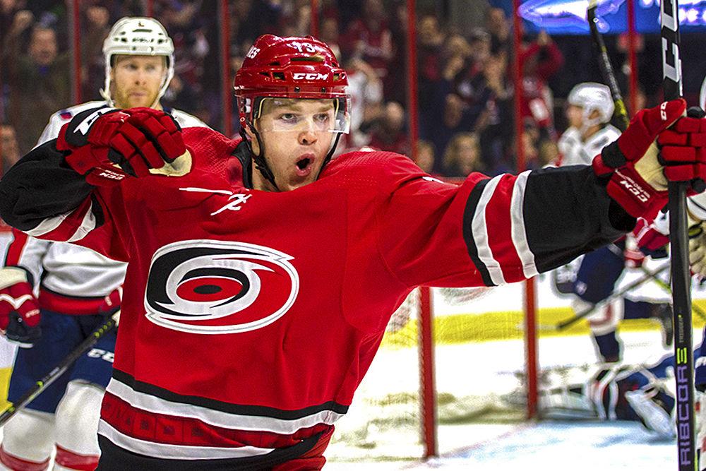 Left winger Warren Foegele bails to celebrate after scoring on Washington Capitals goaltender Braden Holtby during the second period in PNC Arena, Thursday, March 28, 2019. Despite an equally matched hustle throughout regulation, the Canes fell to the Caps, 3-2.
