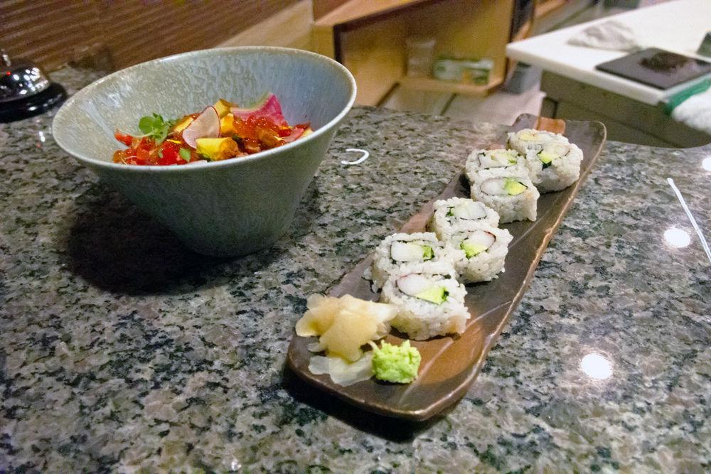 A bowl of chirashi and a plate of California rolls sits at the counter at Sushi Mon, a Japanese restaurant located next to Zaxby's. Sushi Mon is open for dinner services daily, but only serves lunch on Friday and Saturday.